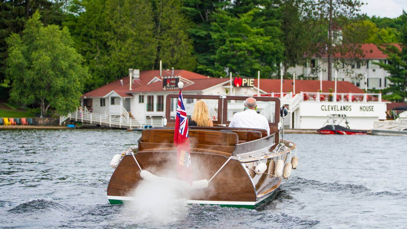 old men and women driving a boat