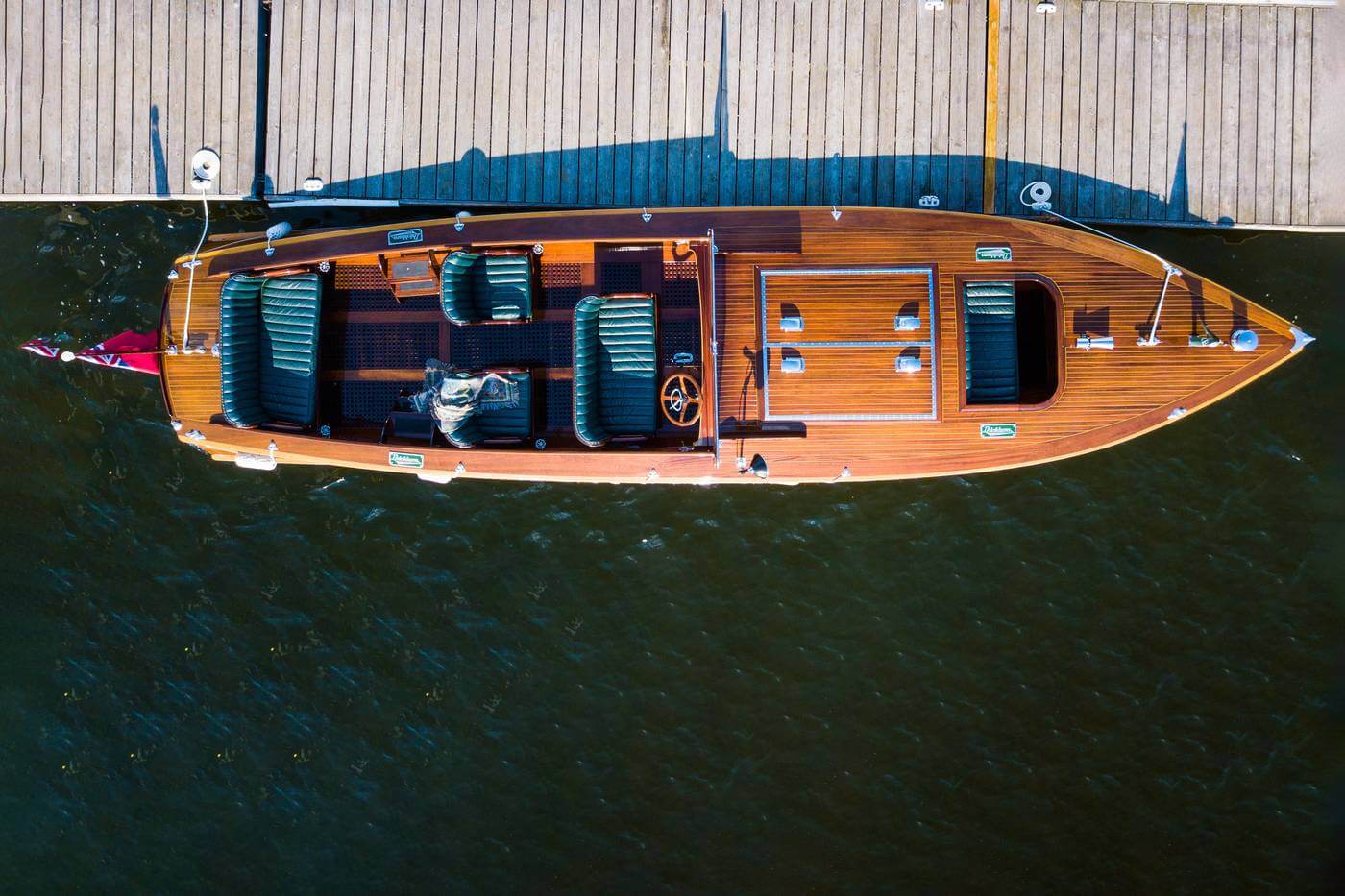 Wooden boat on water from an aerial perspective